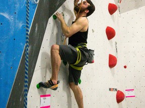 Ben Nehring of London tests a route at the Junction Climbing Centre on Elias Street in London. The gym is hosting an Ontario Climbing Federation Youth Climbing Competition on Saturday. Mike Hensen/The London Free Press/Postmedia Network