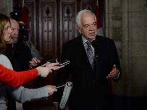 Minister of Immigration, Refugees and Citizenship John McCallum speaks to reporters following a Liberal cabinet meeting on Parliament Hill in Ottawa on Tuesday, Feb. 2, 2016. THE CANADIAN PRESS/Sean Kilpatrick