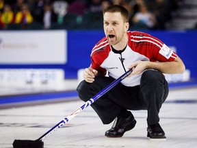 Newfoundland and Labrador skip Brad Gushue yells to his teammates as he plays Northern Ontario during playoff curling action at the Brier in Calgary, Friday, March 6, 2015. (THE CANADIAN PRESS/Jeff McIntosh)