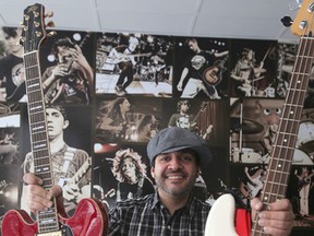 Mike Reis, of School of Rock, shows off some instruments.