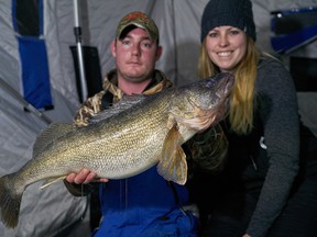 Author Ashley Rae, right, and Bowen Sandercock, left, with an impressive walleye caught and released on Lake Nipissing. (Supplied photo)
