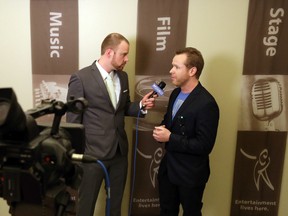 Luke Hendry/The Intelligencer 
Belleville Downtown DocFest host Dug Stevenson interviews Prince Edward County filmmaker Ben Quaiff at the festival's gala at the Empire Theatre in Belleville Friday. The festival runs through Sunday at several downtown venues.
