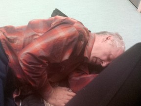 Pete Verberne, a 61-year-old Alzheimer's patient, sleeps on the floor of the Victoria Hospital ER in London where he was kept eight days because of lack of ward beds upstairs (Supplied photo)