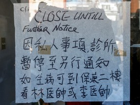 Closed sign on the front door of the office of Dr. Herman Yip-Chi Ng. (Dave Thomas/Toronto Sun/Postmedia Network)