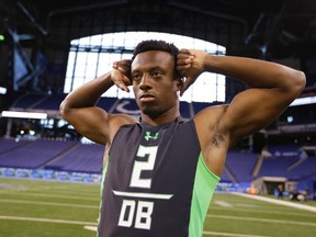 Ohio State defensive back Eli Apple stretches at the NFL football scouting combine in Indianapolis, Monday, Feb. 29, 2016. (AP Photo/Michael Conroy)