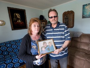 The murder of Robert Ratz Jr. left ?a humongous void,? says his father, Robert Sr., seen here with fiancee Bernadette Fletcher and a photo of his late son. (CRAIG GLOVER, The London Free Press)