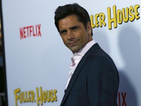Cast member John Stamos poses at the premiere for the Netflix television series "Fuller House" at The Grove in Los Angeles, California February 16, 2016. REUTERS/Mario Anzuoni