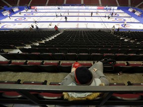 A man looks on from the stands during team practice for the 2016 Tim Horton's Brier at TD Place in Ottawa on Friday. (Darren Brown)