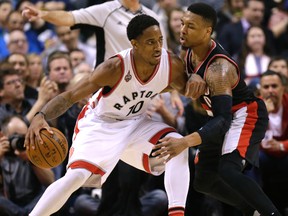 The Toronto Raptors DeMar DeRozan beats Portland Trail Blazers Damian Lillard in Toronto, Ont. on Friday March 4, 2016. (Craig Robertson/Toronto Sun/Postmedia Network)