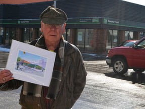 Former Canada Trust bank manager David Harding shows off an acrylic painting of his old workplace. Both TD Canada Trust branches in St. Thomas closed Friday and are relocating to the city's east end. The 75-year-old was the bank manager of the downtown branch from 1974 to 1981.