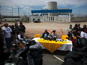 Jose Luis Gonzalez Meza, center, one of Joaquin "El Chapo" Guzman’s lawyers, holds a press conference outside the gates of the Altiplano maximum security prison to announce he would begin a hunger strike in protest over the drug lord's treatment inside the prison, near Toluca, Mexico state, Mexico, Friday, March 4, 2016. (AP Photo/Rebecca Blackwell)