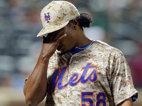 New York Mets pitcher Jenrry Mejia reacts after allowing the Atlanta Braves to score the go-ahead run during the eighth inning of a game at Citi Field in New York, in this file photo taken July 7, 2014. (Brad Penner/USA TODAY Sports/Files)