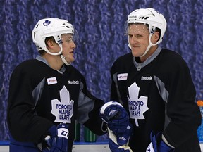 Toronto Maple Leafs defencemen Morgan Rielly and Dion Phaneuf wait for a drill to start during practice at the Mastercard Centre in Toronto on Oct. 10, 2014. (Craig Robertson/Toronto Sun)