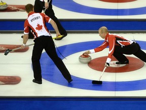 Team Canada Skip Pat Simmons throws a stone against Team Quebec at the Tim Hortons Brier at TD Place in Ottawa on March 05, 2016. (Jean Levac/Postmedia)