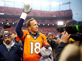 Denver Broncos quarterback Peyton Manning (18) waves to the crowd after the AFC Championship football game against the New England Patriots at Sports Authority Field at Mile High. Mark J. Rebilas-USA TODAY Sports/Files