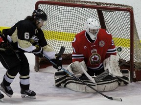 Sarnia Legionnaires goalie Shayne Battler makes a save while teammate Brett Storr defends LaSalle Vipers forward Cale Allen during Game 2 of the Greater Ontario Junior Hockey League Western Conference quarter-final at Sarnia Arena on Saturday, March 5, 2016 in Sarnia, Ont. Terry Bridge/Sarnia Observer/Postmedia Network