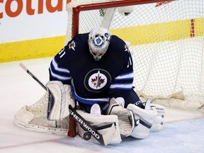 Winnipeg Jets goalie Ondrej Pavelec (31) makes a save during the second period against the Montreal Canadiens at MTS Centre March 5. 2016. (Bruce Fedyck-USA TODAY Sports)