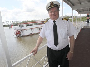 Captain Steve Hawchuck on board the Paddlewheel Queen, with the Paddlewheel Princess in the background in 2012. (Winnipeg Sun Files)
