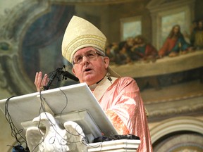 Cardinal Thomas Collins reads a statement about assisted dying during Sunday mass at St. Paul's Basilica in Toronto March 6, 2016. (Craig Robertson/Toronto Sun)