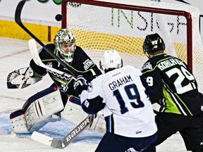 Edmonton Oil Kings goalie Patrick Dea stops Saskatoon Blades' Ryan Graham during a previous meeting at Rexall Place. The two teams are back there Monday at 7 p.m. (File)