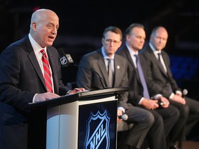 NHL Deputy Commissioner Bill Daly (l) announces that Winnipeg will host the Heritage Classic as (l-r) Winnipeg Jets owner Mark Chipman, former Jet Dale Hawerchuk and Edmonton Oilers vice chairman Kevin Lowe during a press conference in Winnipeg, Man., on Sunday March 06, 2016.