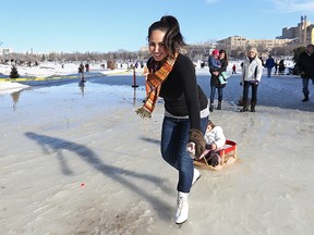 A skater pulls a sled down a soggy trail during the final day the Red River Mutual Trail at The Forks in Winnipeg was open on Sunday, March 6, 2016. (Kevin King/Winnipeg Sun/Postmedia Network)