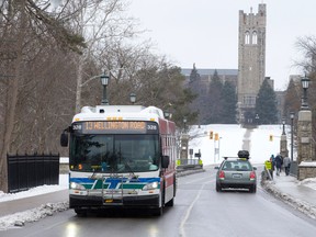 A London Transit bus drives across the University Drive Bridge on its route through the Western University campus. (CRAIG GLOVER, The London Free Press)