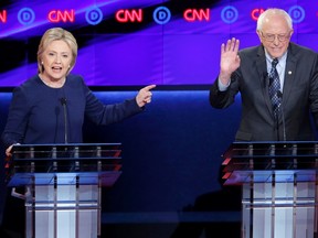 Democratic U.S. presidential candidate Hillary Clinton gestures at rival Bernie Sanders during the Democratic U.S. presidential candidates' debate in Flint, Michigan, March 6, 2016. REUTERS/Jim Young