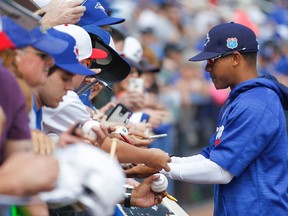 Toronto Blue Jays starting pitcher Marcus Stroman signs autographs before the first inning of a spring training game against the Baltimore Orioles at Florida Auto Exchange Park in Dunedin, Fla., on March 4, 2016. (Reinhold Matay/USA TODAY Sports)