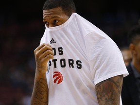 Toronto Raptors' James Johnson can't bear to watch the fourth quarter of a game against the Houston Rockets at the Air Canada Centre in Toronto on March 6, 2016. (Jack Boland/Toronto Sun/Postmedia Network)
