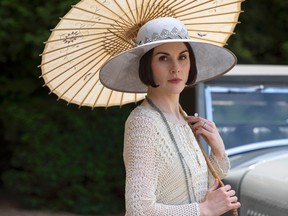 This image released by PBS shows Michelle Dockery as Lady Mary in a scene from the final season of "Downton Abbey." (Nick Briggs/Carnival Film & Television Limited 2015 for MASTERPIECE via AP)