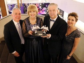 Heather and John Williams, centre, hold their 2016 Guardian Angels statuette at The Children's Foundation Guardian Angel Gala in Belleville Saturday. Flanking them were event co-chairs Tom and Golda Lafferty. The gala is the flagship fundraiser for the foundation.