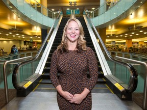 Julie Gonyou, project manager of the central library revitalization project, stands beside the escalators which will be shut down for eleven months during renovations, at the London Public Library Central Branch in London, Ont. on Friday March 4, 2016. Elevators are available for those unable to use stairs, and a second floor entrance from Citi Plaza may be reopened during the project, says Gonyou.  Craig Glover/The London Free Press/Postmedia Network