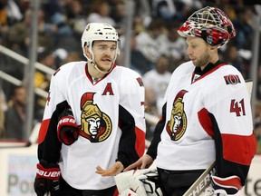 Ottawa Senators defenceman Mark Borowiecki (74) and goalie Craig Anderson (41) talk during a time-out against the Pittsburgh Penguins in the second period at the CONSOL Energy Center. The Penguins won 6-5. Charles LeClaire-USA TODAY Sports