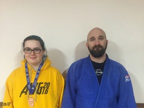 Local athlete, Sydney Kennedy (left), poses for a photo with her sensei Craig Stevens (right) after an interview with the Western Review.