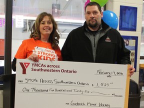 Goderich Minor Hockey donated $1,525 to the Strong Kids campaign, which supports the Recreation, Arts & Sports Program. Pictured here, Jenn Evans, YMCA community engagement coordinator and Greg Robinson, president of Goderich Minor Hockey. (Laura Broadley/Goderich Signal Star)