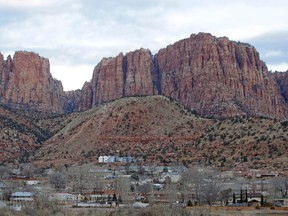 This Dec. 16, 2014, file photo, shows Hildale, Utah, sitting at the base of Red Rock Cliff mountains, with its sister city, Colorado City, Ariz., in the foreground. (AP files photo)