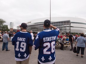 Quebec Nordiques fans wait outside the Videotron Centre where the arena hosted its first hockey game between the Quebec Remparts and Rimouski Oceanic of the QJMHL on Saturday, Sept. 12, 2015 in Quebec City. (Jacques Boissinot/THE CANADIAN PRESS)
