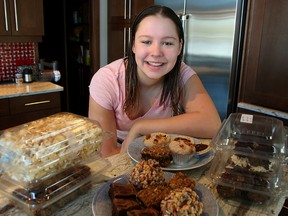 Reese Precourt displays some of the baking she has collected for Lighthouse Mission at her home in St. Andrews, Man. Monday March 07, 2016.