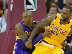 Lakers forward Kobe Bryant defends Cleveland Cavaliers forward LeBron James. Bryant will be retiring at the end of the season. (USA TODAY)