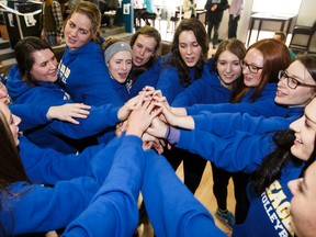 Members of The King's University Eagles women's volleyball team get together for a group cheer. The Eagles are off to the CCAA National Championship in Charlottetown this upcoming weekend.