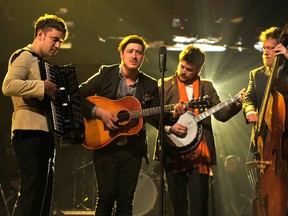(L-R) Musicians Ben Lovett, Marcus Mumford, 'Country' Winston Marshall and Ted Dwane of Mumford & Sons perform onstage at MusiCares Person Of The Year Honoring Bruce Springsteen on February 8, 2013
