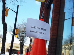 Traffic cones warn pedestrians passing the Judith and Norman Alix Art Gallery in Sarnia about falling ice on Friday March 4, 2016 in Sarnia, Ont. Lambton County officials are seeking money in this year's county budget to fix the problem. (Paul Morden, The Observer)
