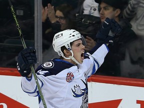 Manitoba Moose right winger Scott Kosmachuk celebrates his first period goal against the Texas Stars during AHL hockey in Winnipeg, Man. Wednesday February 10, 2016.