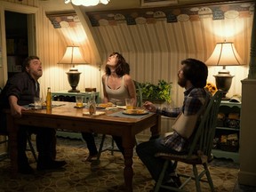 This image released by Paramount Pictures shows John Goodman, from left, Mary Elizabeth Winstead and John Gallagher Jr. in a scene from "10 Cloverfield Lane." (Michele K. Short/Paramount Pictures)