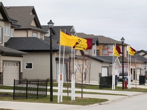 A group of display homes is seen in the Amber Trails area of Winnipeg, Man. Monday Nov. 4, 2013. The city is considering putting a heavy tax on new home purchases to offset infrastructure costs.
