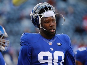 In this Jan. 3, 2016, file photo, New York Giants defensive end Jason Pierre-Paul warms up before playing against the Philadelphia Eagles in an NFL football game in East Rutherford, N.J. (AP Photo/Julio Cortez, File)