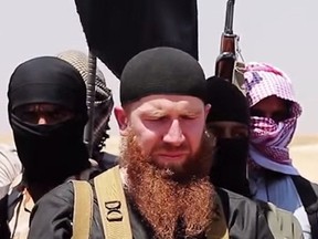 An image made available by Jihadist media outlet al-Itisam Media on June 29, 2014, allegedly shows members of ISIS, including military leader and Georgian native Abu Omar al-Shishani (Tarkhan Batirashvili), speaking at an unknown location between the Iraqi Nineveh province and the Syrian town of Al-Hasakah. (AFP PHOTO/HO/Al-Itisam Media)