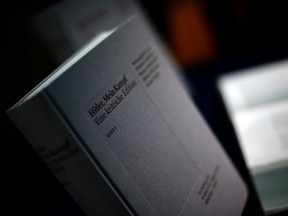 A copy of "Hitler, Mein Kampf – A critical edition" is presented prior to a news conference in Munich, Germany, Friday, Jan. 8, 2016. (AP Photo/Matthias Schrader)