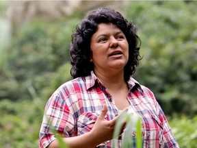 In this Jan. 27, 2015 photo released by The Goldman Environmental Prize, Berta Caceres speaks to people near the Gualcarque river located in the Intibuca department of Honduras. TIM RUSSO / AP